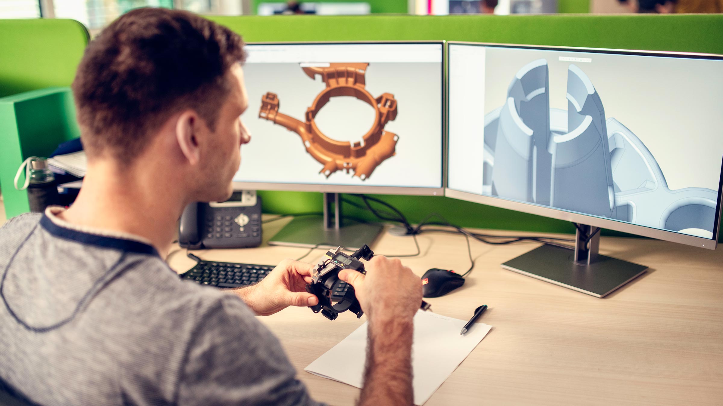 Engineer examining product model